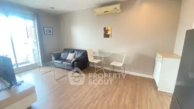 Modern living room with air conditioning and wooden flooring