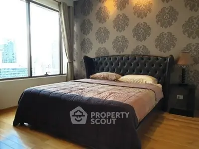Luxurious bedroom with city view and elegant decor in modern apartment