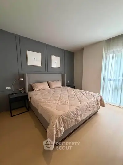 Modern bedroom with stylish decor and natural light