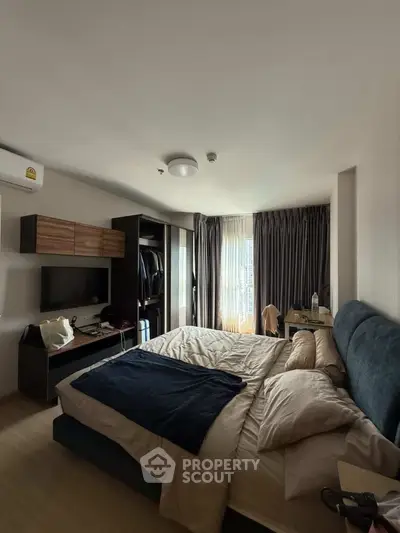 Cozy bedroom with modern furnishings and natural light