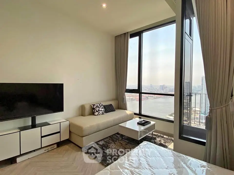 Modern living room with stunning river view and sleek furniture