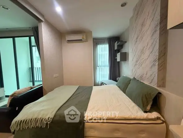 Cozy bedroom with modern decor and balcony view