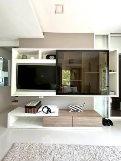 Modern living room with sleek entertainment center and stylish decor