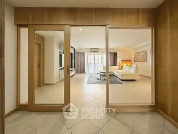 Spacious living room with modern decor and large windows for natural light.