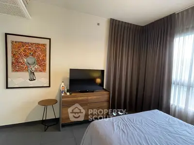 Modern bedroom with stylish decor and natural light