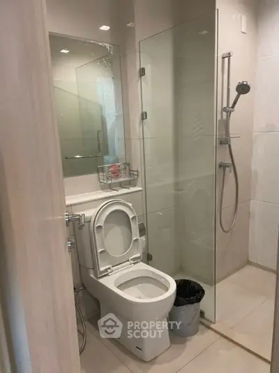 Modern bathroom with glass shower and sleek fixtures