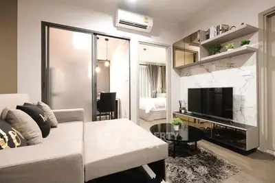 Modern living room with stylish decor and open layout in a contemporary apartment.