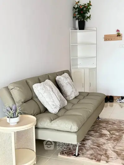 Cozy living room with modern sofa and stylish decor, perfect for relaxation and comfort.
