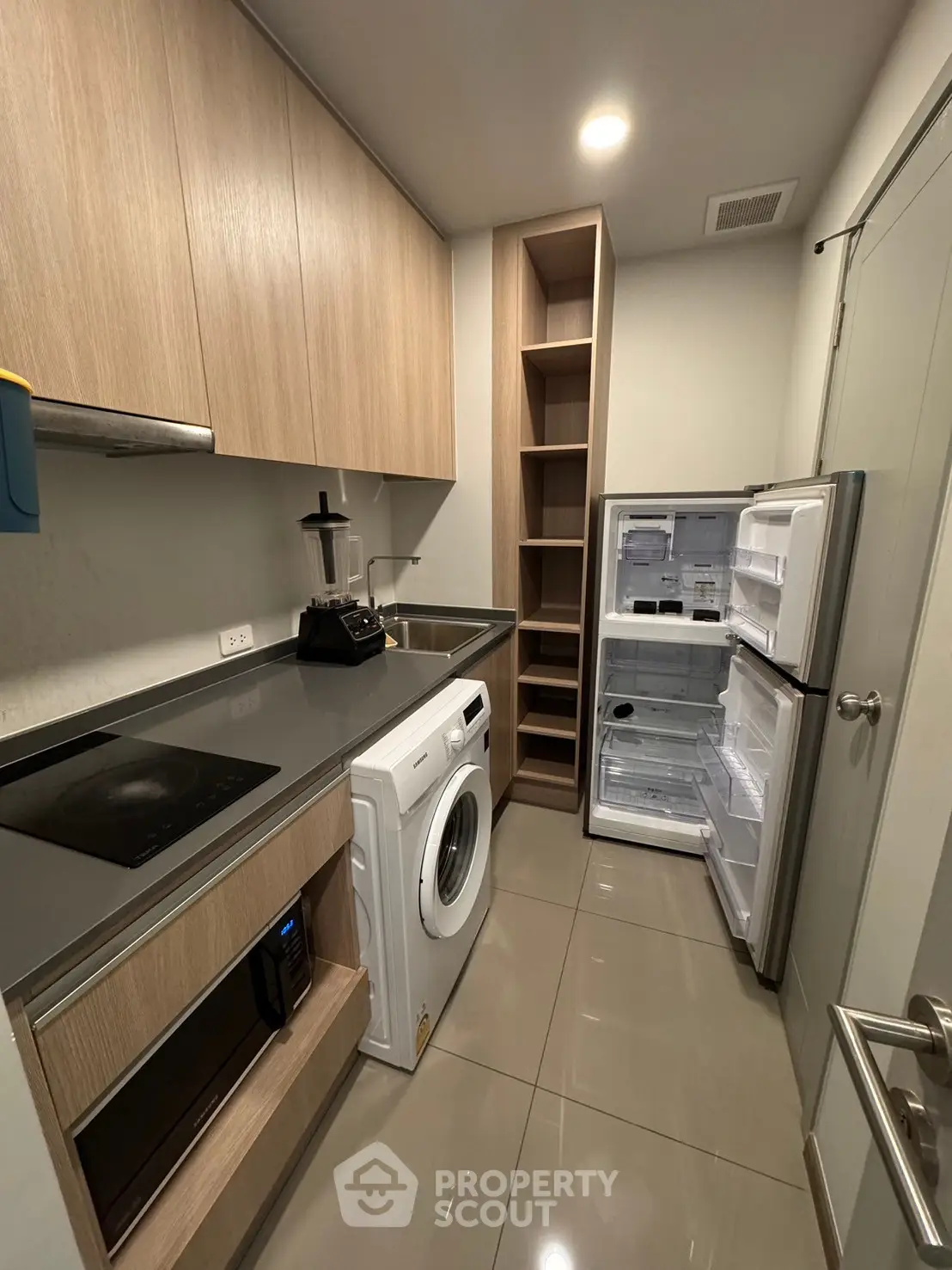 Modern kitchen with sleek appliances and ample storage space
