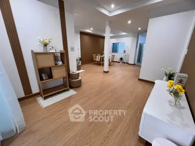 Spacious modern living room with elegant wooden flooring and stylish decor