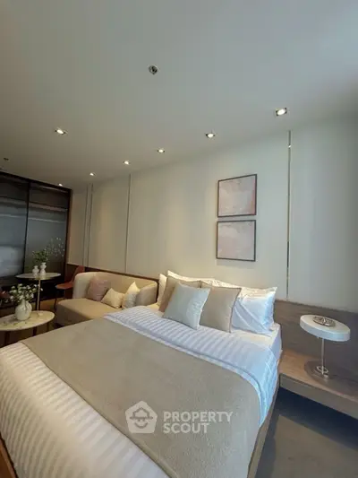 Luxurious modern bedroom with cozy bed and elegant decor