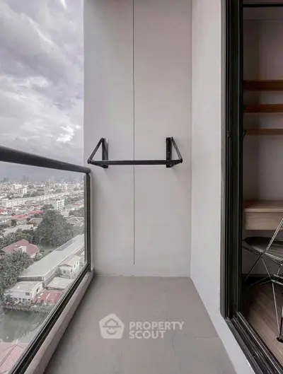 Modern balcony with city view and sleek railing, perfect for urban living.