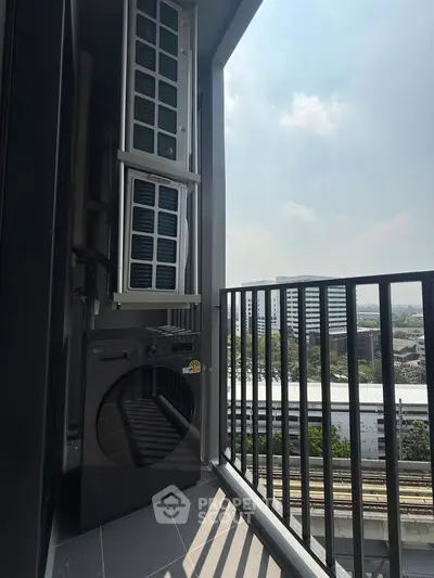 Modern balcony with washing machine and city view, perfect for urban living.
