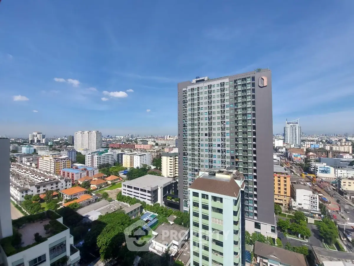 Stunning cityscape view with modern high-rise buildings under a clear blue sky.