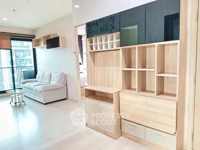 Spacious modern living room with stylish shelving and large windows