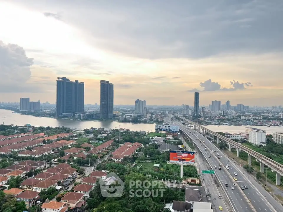 Stunning cityscape view with river and high-rise buildings at sunset