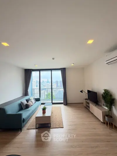 Spacious modern living room with city view and stylish decor
