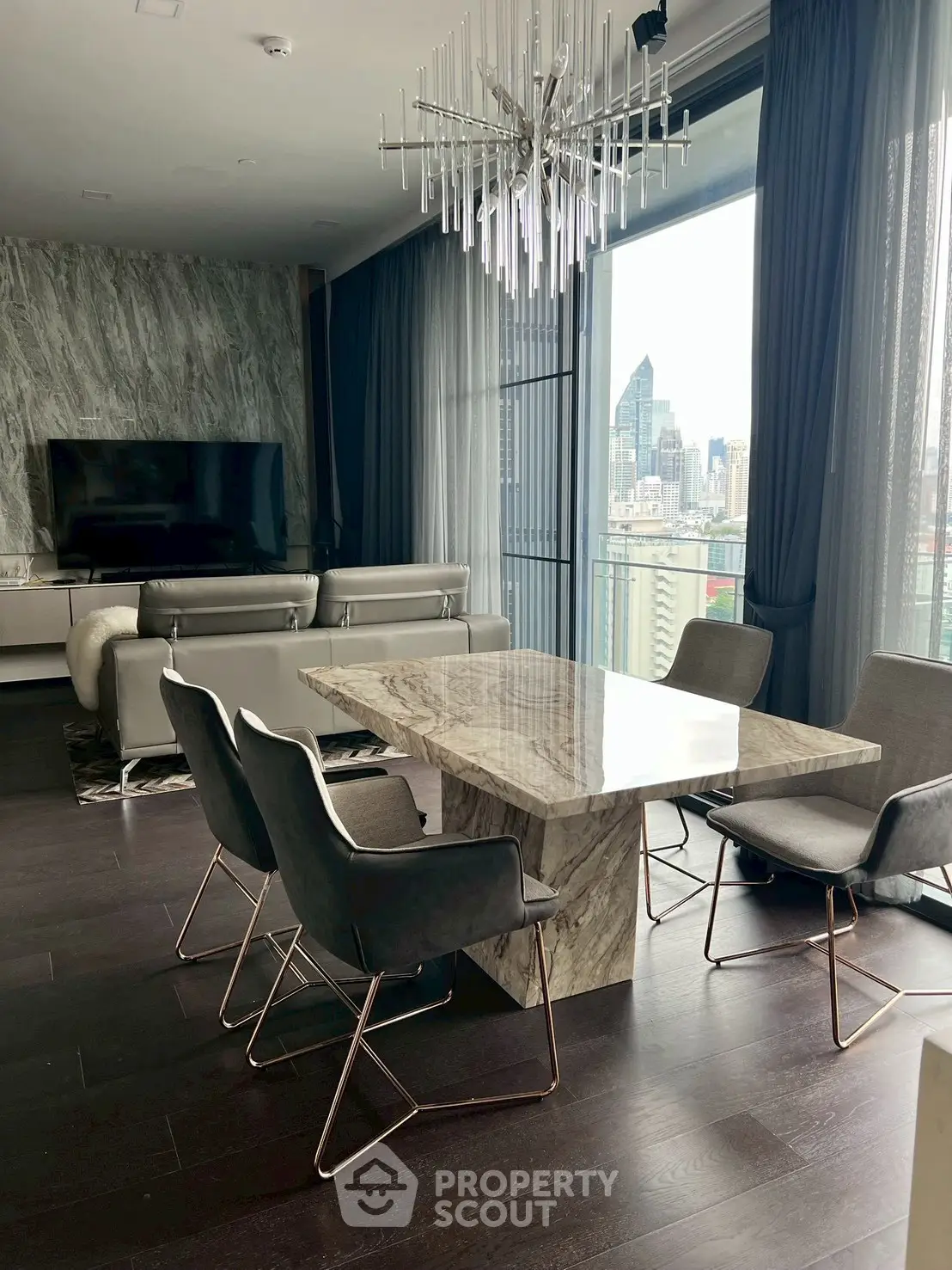 Luxurious modern living room with marble dining table and city view.