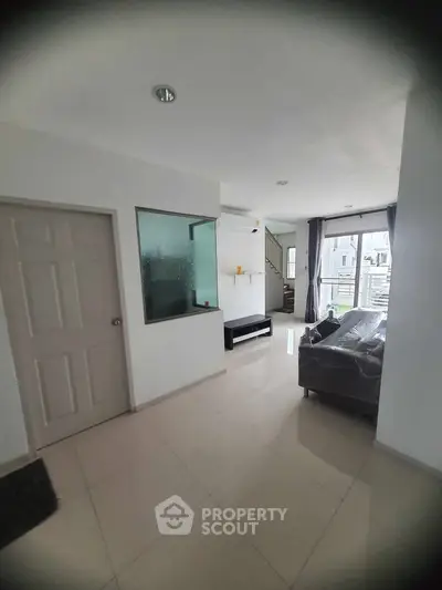 Spacious modern living room with sleek design and natural light