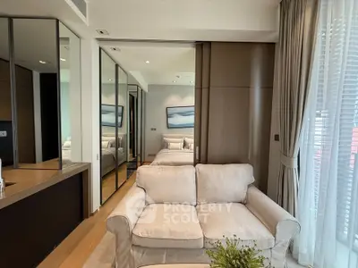 Modern living room with elegant decor and large windows