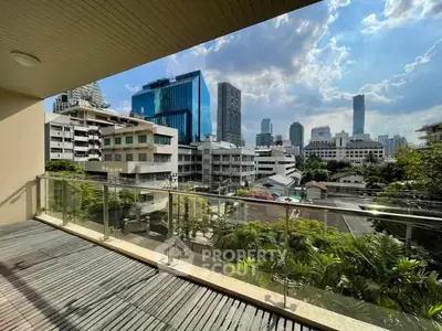 Spacious balcony with stunning city skyline view, perfect for urban living.
