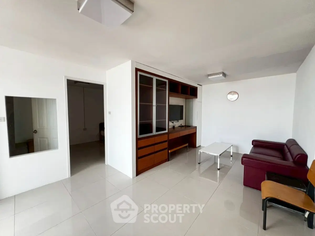 Spacious living room with modern furniture and built-in shelving