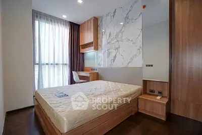 Modern bedroom with stylish wood accents and large window for natural light
