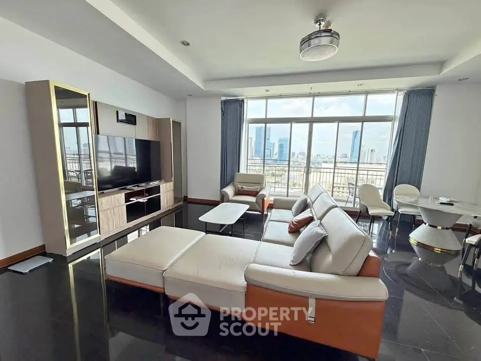 Spacious modern living room with city view, featuring elegant furniture and large windows.