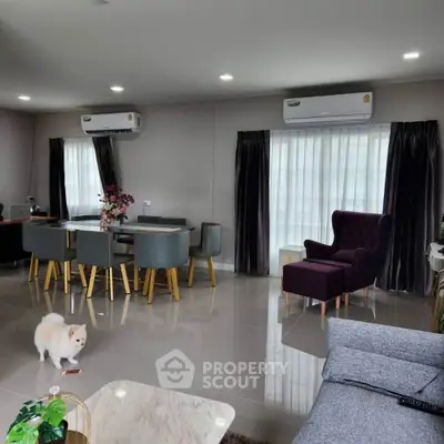 Spacious modern living room with elegant dining area and cozy seating