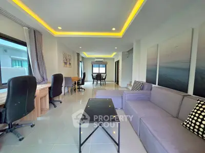 Spacious modern living room with stylish furniture and ambient lighting