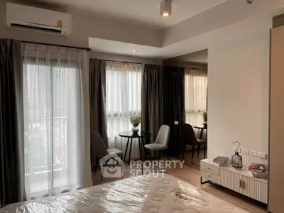 Modern bedroom with balcony view and stylish furniture in urban apartment