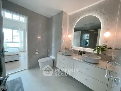 Luxurious modern bathroom with dual sinks and elegant marble finishes