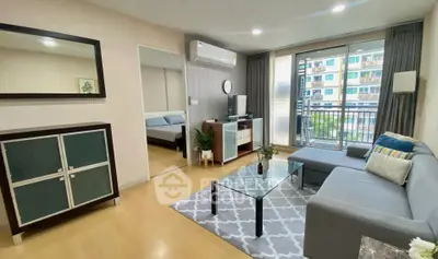 Modern living room with cozy sofa and balcony view in urban apartment