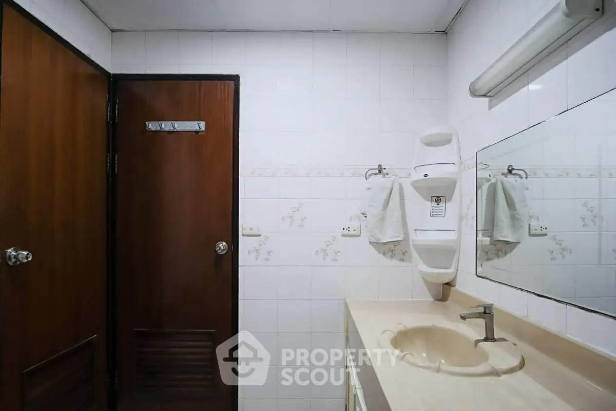 Spacious bathroom with modern fixtures and ample lighting