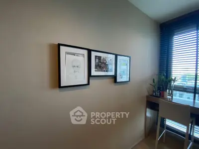 Modern study area with framed art and natural light