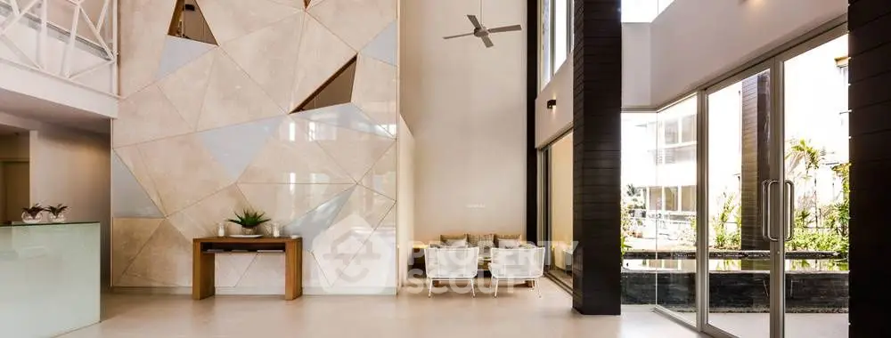 Luxurious modern building entrance with stylish decor and natural light