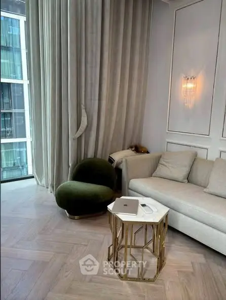 Luxurious living room with high ceilings, elegant curtains, and modern furniture in a stylish apartment.