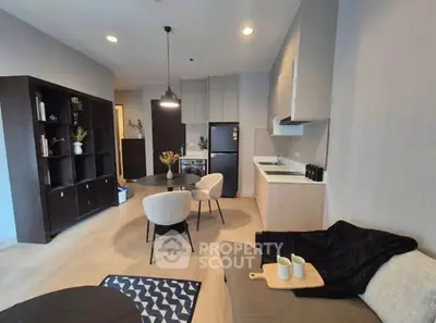 Modern open-layout living room with stylish kitchen and cozy seating area