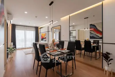 Modern dining area with elegant decor and large mirror in a stylish apartment