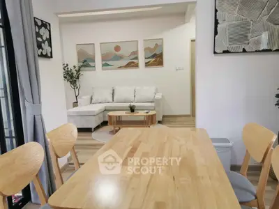 Modern living room with stylish decor and wooden dining set