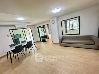 Spacious modern living room with open layout and stylish furniture in a contemporary apartment.