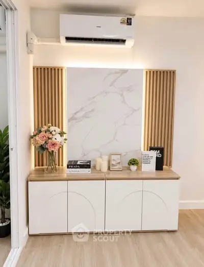Stylish modern living room with elegant decor and air conditioning unit