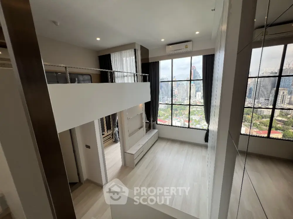 Modern loft apartment with large windows and city view