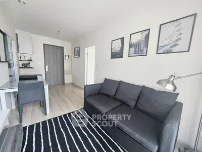 Modern living room with stylish decor and comfortable seating in a contemporary apartment.