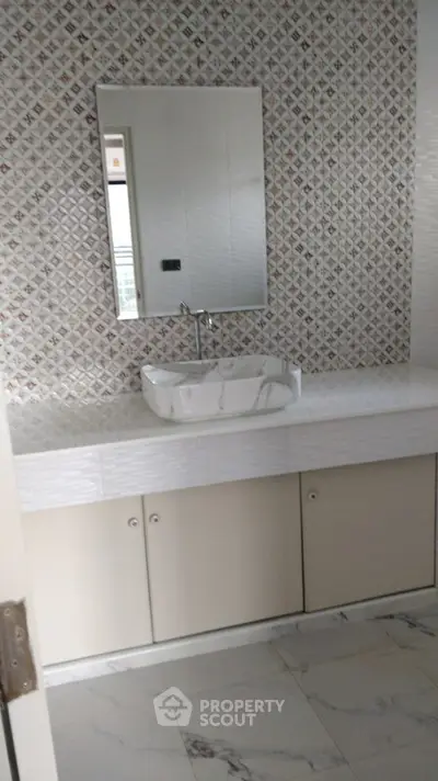 Modern bathroom with stylish sink and elegant tile design