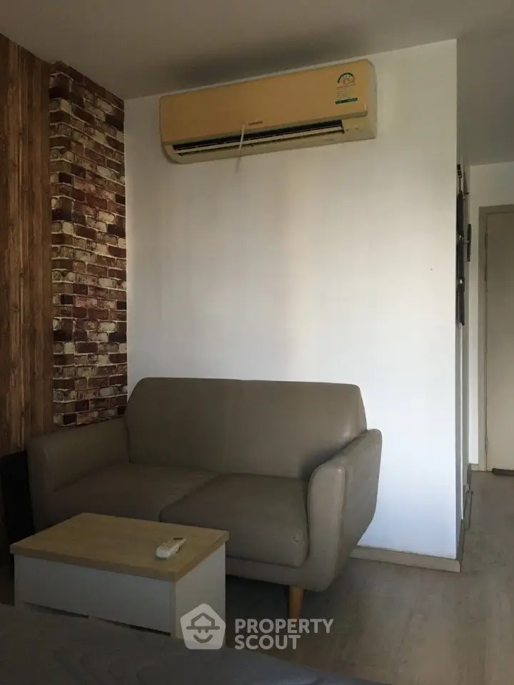 Cozy living room with air conditioning and modern sofa