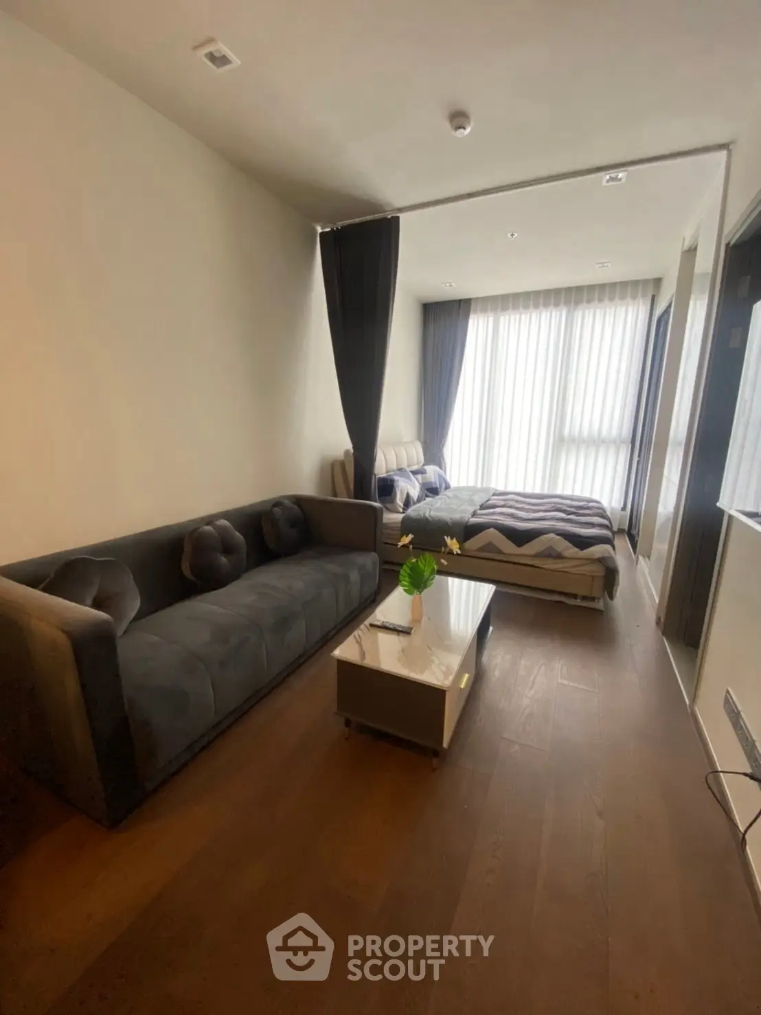 Modern studio apartment with cozy living area and stylish decor