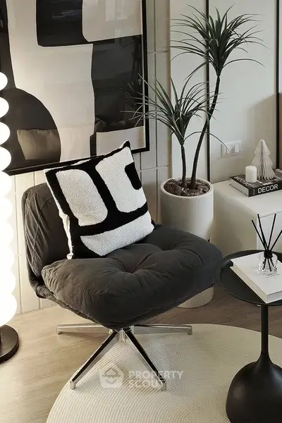 Stylish modern living room corner with designer chair and decor