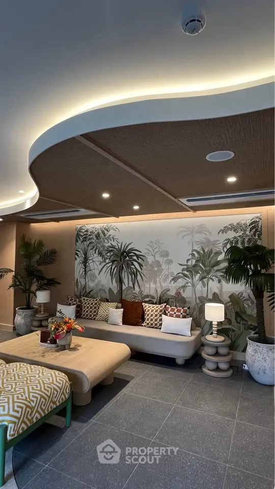 Luxurious living room with stylish decor and tropical-themed wall art