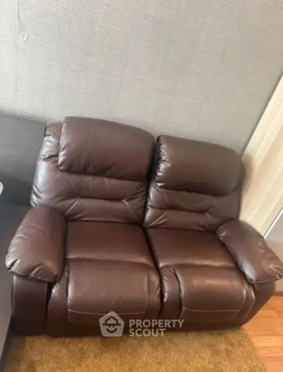 Luxurious brown leather recliner sofa in modern living room setting